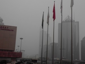 In the business district in Beijing, China. This is not smog, but a bad air quality, polluted day.