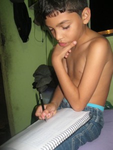 Working hard- Dieguito fully concentrated on his homework.