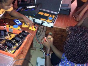 Girls in Cameroon get their hands on electronic circuits from a mobile on the go “STEM Box” kit. The project is geared towards getting more girls interested in science.