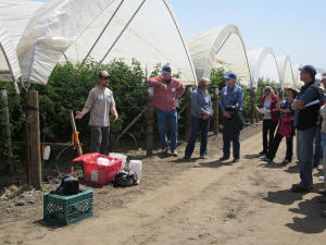 Michael Johnson of the Resource Conservation District demonstrates various tools for assisting growers with irrigation fertilization evaluations.