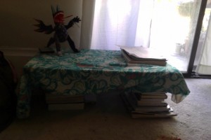 Home made floor desk! Good for the back, bad for when I actually need one of those books to do something besides hold up scarf covered plywood...
