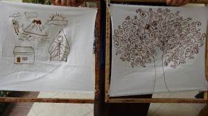First we drew our design with pencil and then traced over it with wax.  Yasser's is on the left and mine on the right.